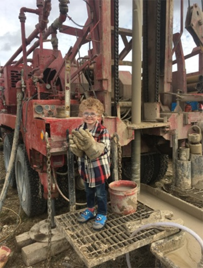 boy on back of rig